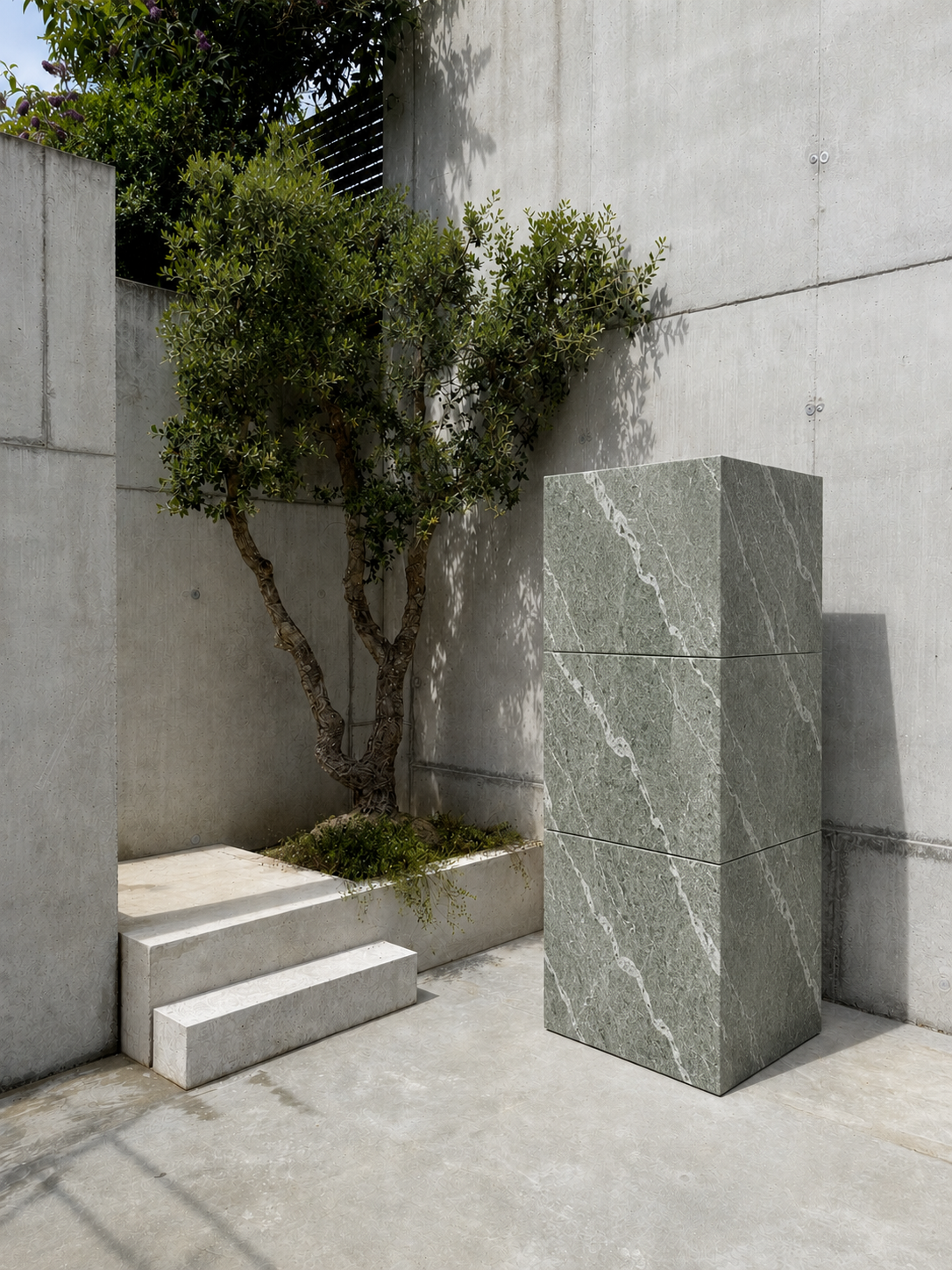 RO. stacked module in veined natural stone next to a concrete bench